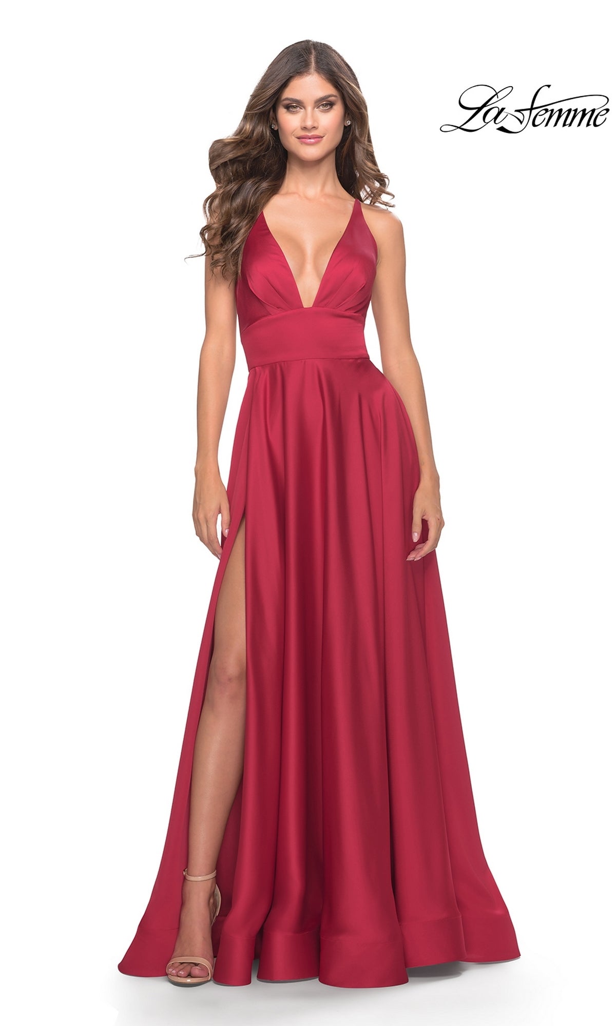 A woman wears the La Femme 31533 deep V-neck, sleeveless, floor-length red A-line prom dress with a high slit, posing against a white background.